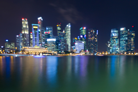 Night blurred bokeh light Singapore city downtown, abstract backgroundの写真素材