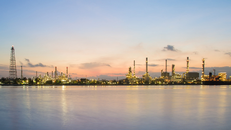 Sunrise over Oil refinery river front, industrial and natural landscape background