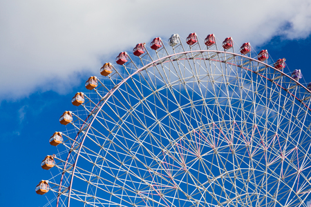 Big funfair ferris wheel with blue sky background in Kyoto Japanの写真素材