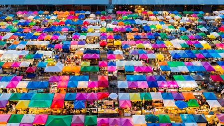 Night market roof top, multiple colour cityscape downtown backgroundの写真素材