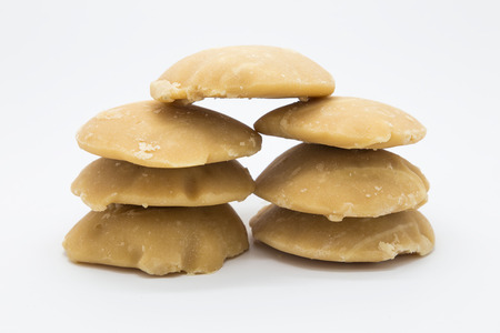 Stack hard palm surgar on white backgroundの写真素材