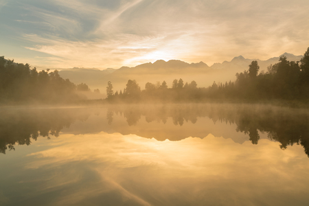 Matheson lake with reflection during sunrise, New Zealand natural landscape backgroundの写真素材