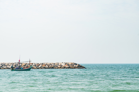 Long tail fishing boat on seacoast, natural landscape backgroundの写真素材