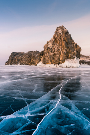 Rock on freezing water lake southern Siberia Baikal Lake, natural winter season landscape backgroundの写真素材