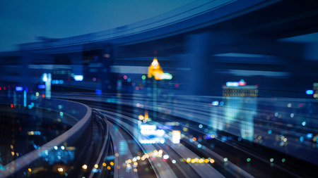 Double exposure city night bokeh light over motion train moving, abstract backgroundの写真素材