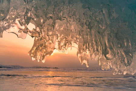 Beautiful sun light over frozen ice cave wall, Siberia Russia winter season, natural landscape  の写真素材