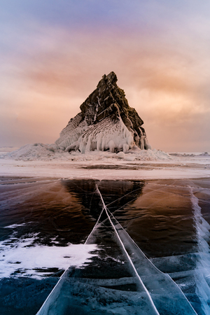 Olkhon rock over Baikal freezing water lake, winter season Russiaの写真素材
