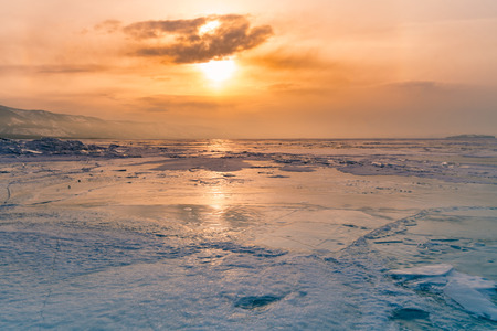 Beautiful sunset over Baikal Siberia Russia winter season, natural landscape backgroundの写真素材