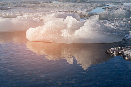 Ice on glacier water lake with reflection, Iceland winter season natural landscape backgroundの写真素材
