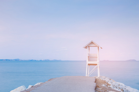 White lifeguard stand with sea coast skyline, natural landscape backgroundの写真素材