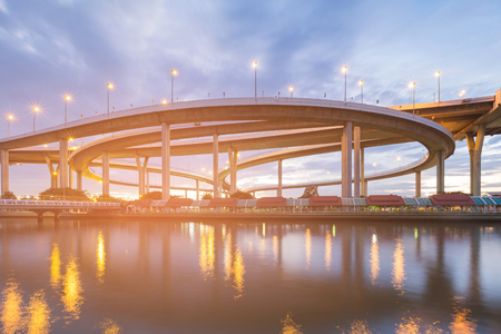 Highway round interconection river front and reflectionの写真素材