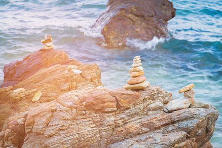 Stack rock on sea beach, natural abstract backgroundの写真素材