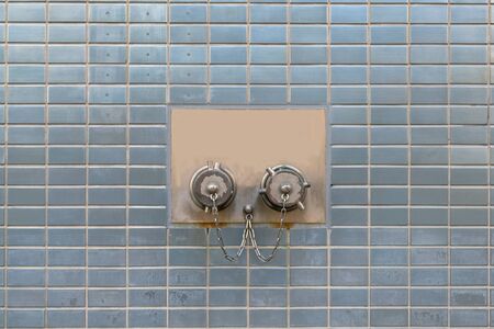 Fire head on vintage square tiles wall backgroundの写真素材