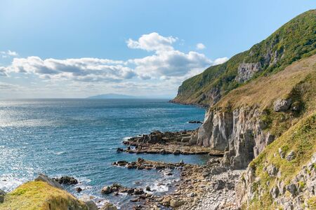 Sea coast skyline over rock mountain, natural landscape background