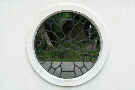 Ancient vintage Chinese window, traditional design backgroundの写真素材