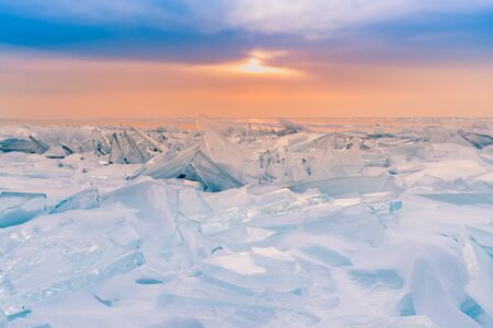 Baikal frost water lake with sunset skyline, winter season natural landscape Russia