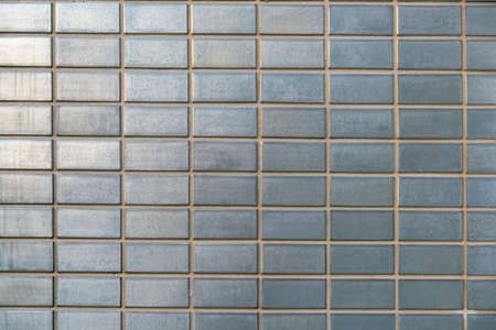 Gray vintage mosaic brick tiles wall background