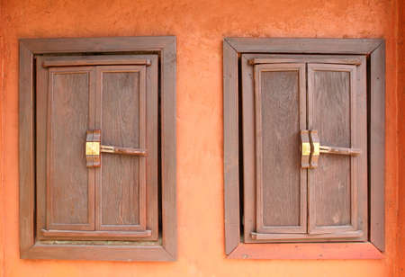 Twin antique wooden windows as background
