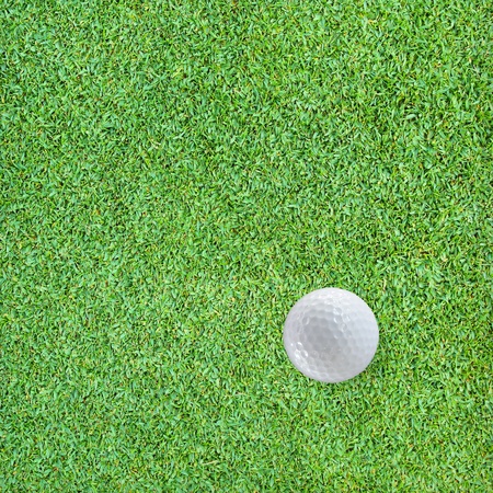 Golf Ball on the Green Grassの写真素材