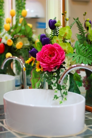 Flower at wash basin in a  bathroomの写真素材