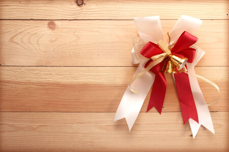 ribbon bow on woodenの写真素材