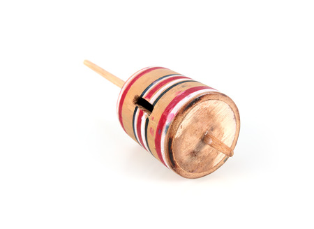 One wooden spinning top isolated in white background