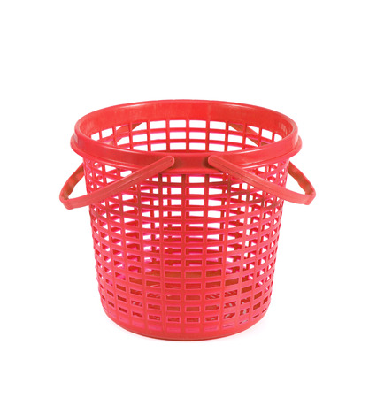 red plastic basket isolated on white backgroundの写真素材