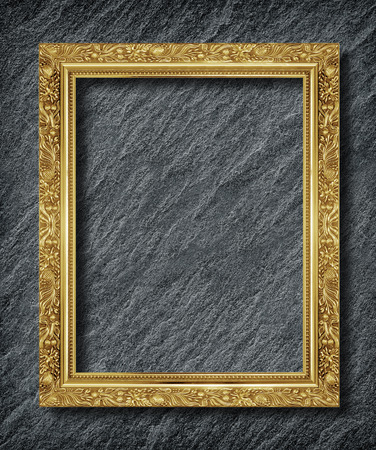 gold frame on  black slate backgroundの写真素材