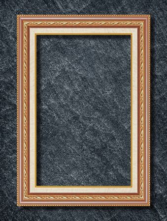 gold frame on black slate backgroundの写真素材