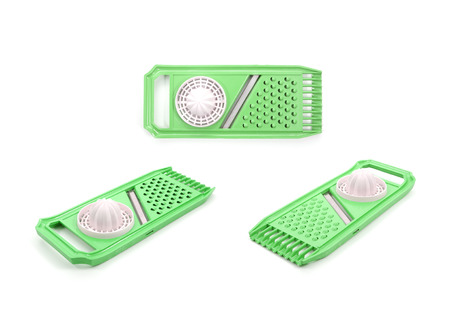 plastic squeezer and slicer used to cut vegetables isolated on white backgroundの写真素材