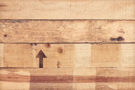 Old wood plank wooden wall with aerow symbol and Stain for backgroundの写真素材