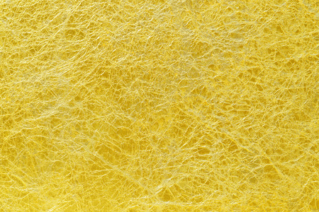 Shiny yellow leaf gold foil texture backgroundの写真素材