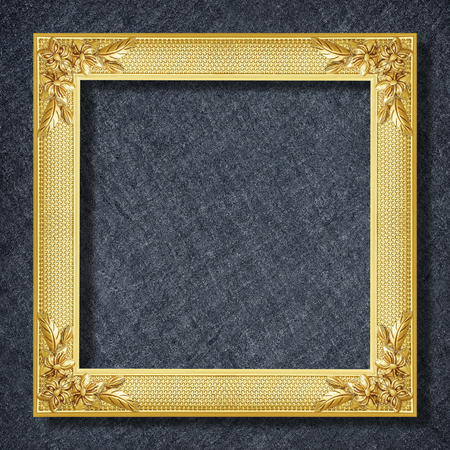 gold frame on Dark grey black slate background or texture.