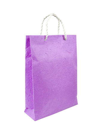 Purple paper bag isolated on whiteの写真素材
