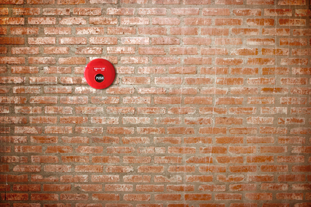 fire break glass on brick walll backgroundの写真素材