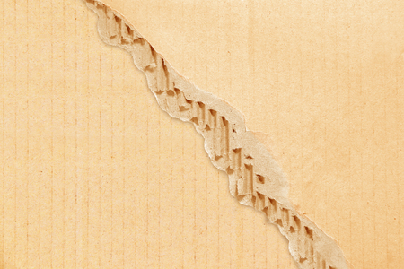 Brown corrugated or cardboard sheet texture paper torn backgroundofの写真素材