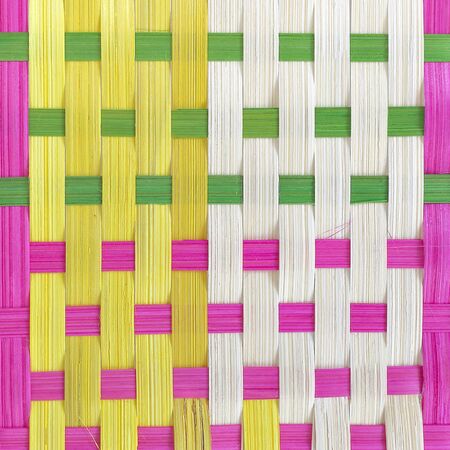 Colorful woven bamboo mat close up, background textureの写真素材