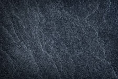 Dark grey stone / black slate stone background or textureの写真素材