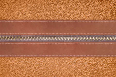 brown leather with zipper for backgroundの写真素材