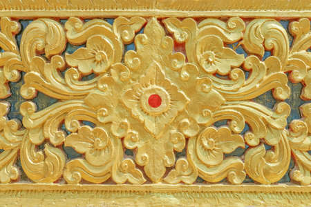 Background of cement gold decorative pattern,Traditional thai design in Thailand Temple wallの写真素材