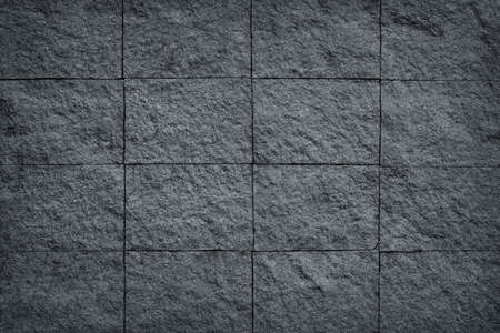 Dark grey black slate stone wall background or texture.の写真素材