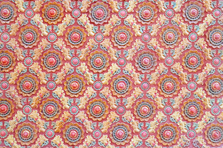 Thai traditional style art pattern on temple wall ,design of native thai style on the Wall.の写真素材