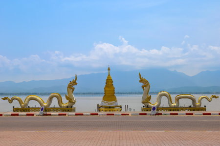 Pagoda and king of Nagaes statue at the holy lake of Phayao, Phayao, Thailandの写真素材