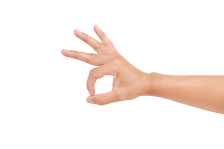 Gesturing approval expression doing okay symbol with fingers.Hand of caucasian young man showing fingers over isolated on white background with clipping path include for design usage purpose.の写真素材