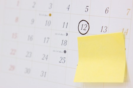 office calendar with appointment mark and blank postit note paper の写真素材