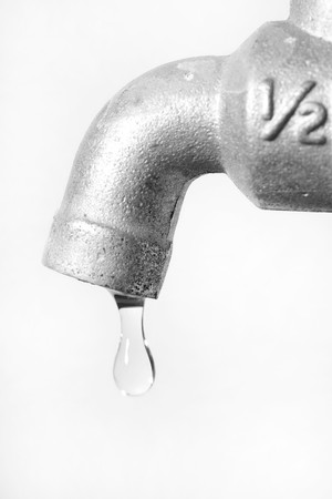 Water leaking from tap conceptual for environment preservation の写真素材