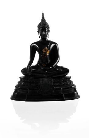 Ancient scratch black buddha on white background の写真素材