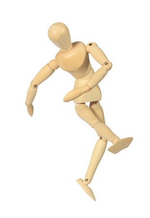 Yellow wooden dummy in kick action isolated on white backgroundの写真素材