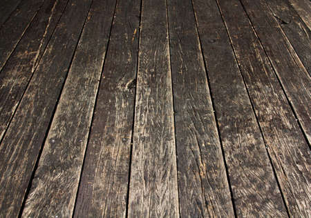Dark brown grunge rusty wooden floor の写真素材