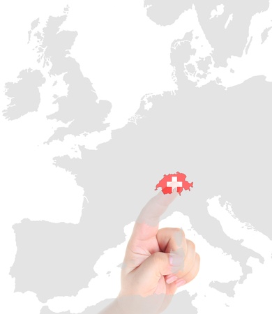 Finger touch on Switzerland map flagの写真素材